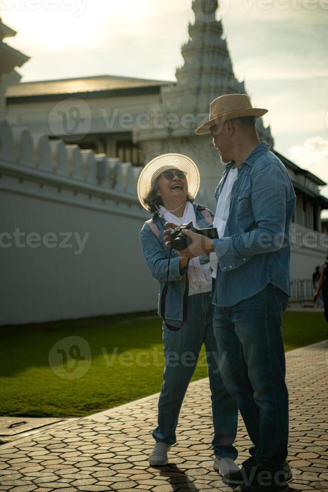Senior couples' tourist activities around the Grand Palace and Wat Phra Kaew, Thailand photo