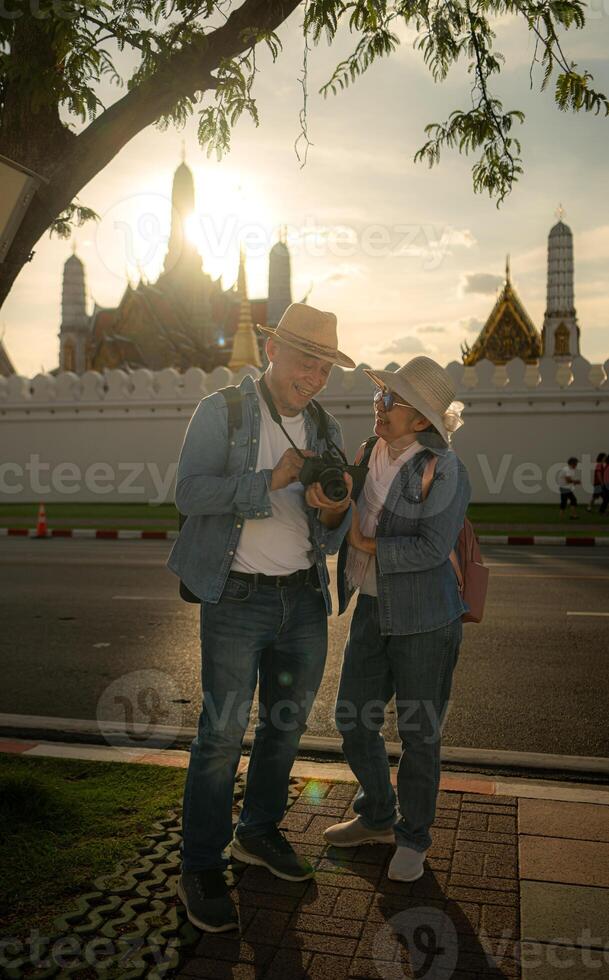 Senior couples' tourist activities around the Grand Palace, Thailand photo