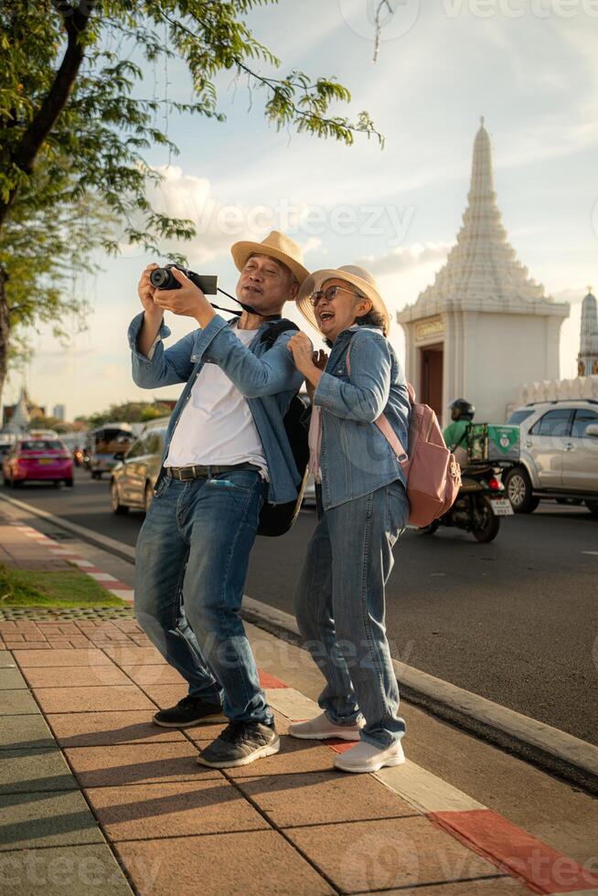 Senior couples' tourist activities around the Grand Palace, Thailand photo