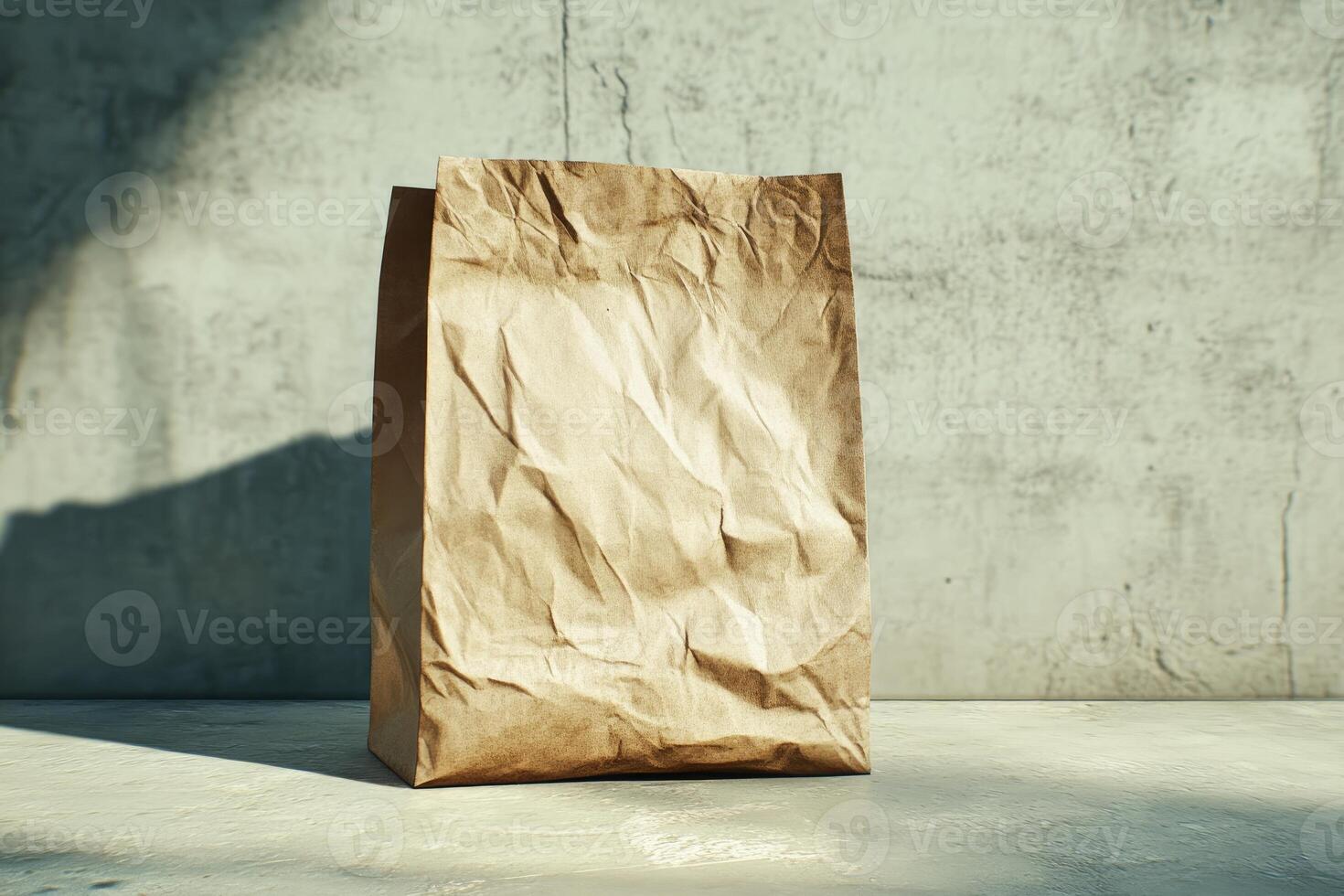 A Crumpled Brown Paper Bag on a Light Concrete Surface photo