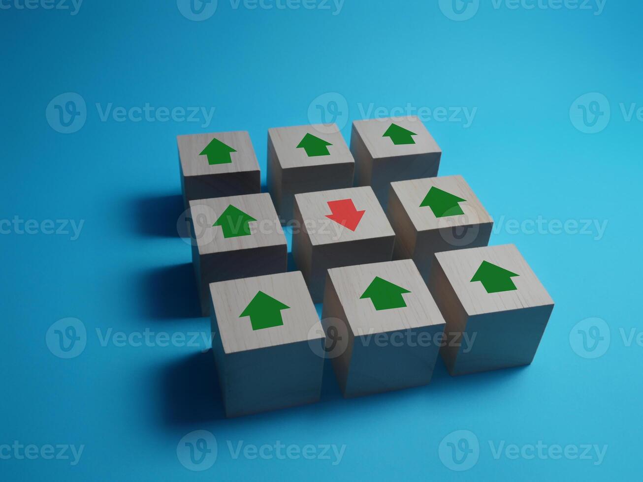sell stocks up down different Red arrow pointing down part way with other arrows photo
