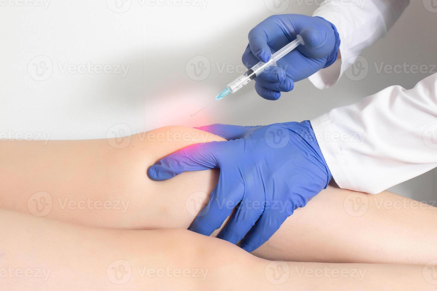 The doctor injects an ozone-oxygen mixture into the patient's knee joint to relieve muscle spasm and inflammation. Ozone therapy, copy space for text photo