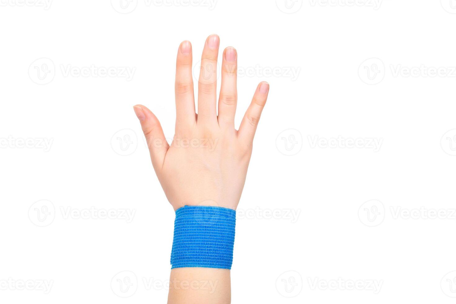 Blue elastic bandage on the wrist on a white background, isolate. Concept for fixation of the wrist joint for sports and avoidance of injuries, close-up photo