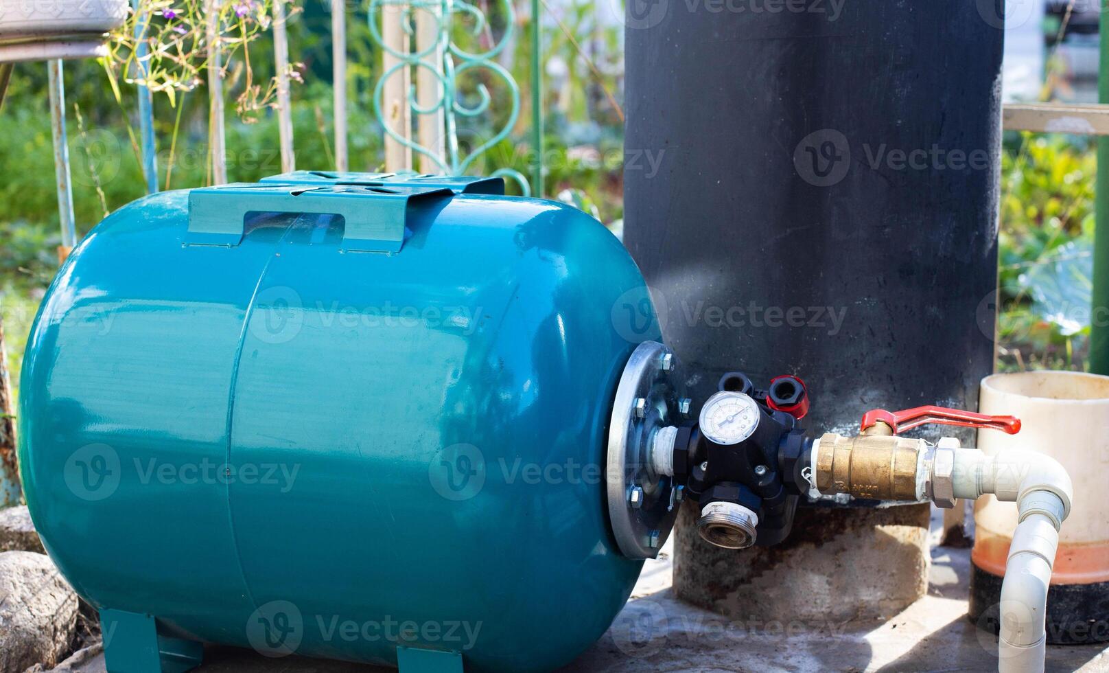 Water supply system with a hydraulic tank and a cleaning filter from a well in the country. photo