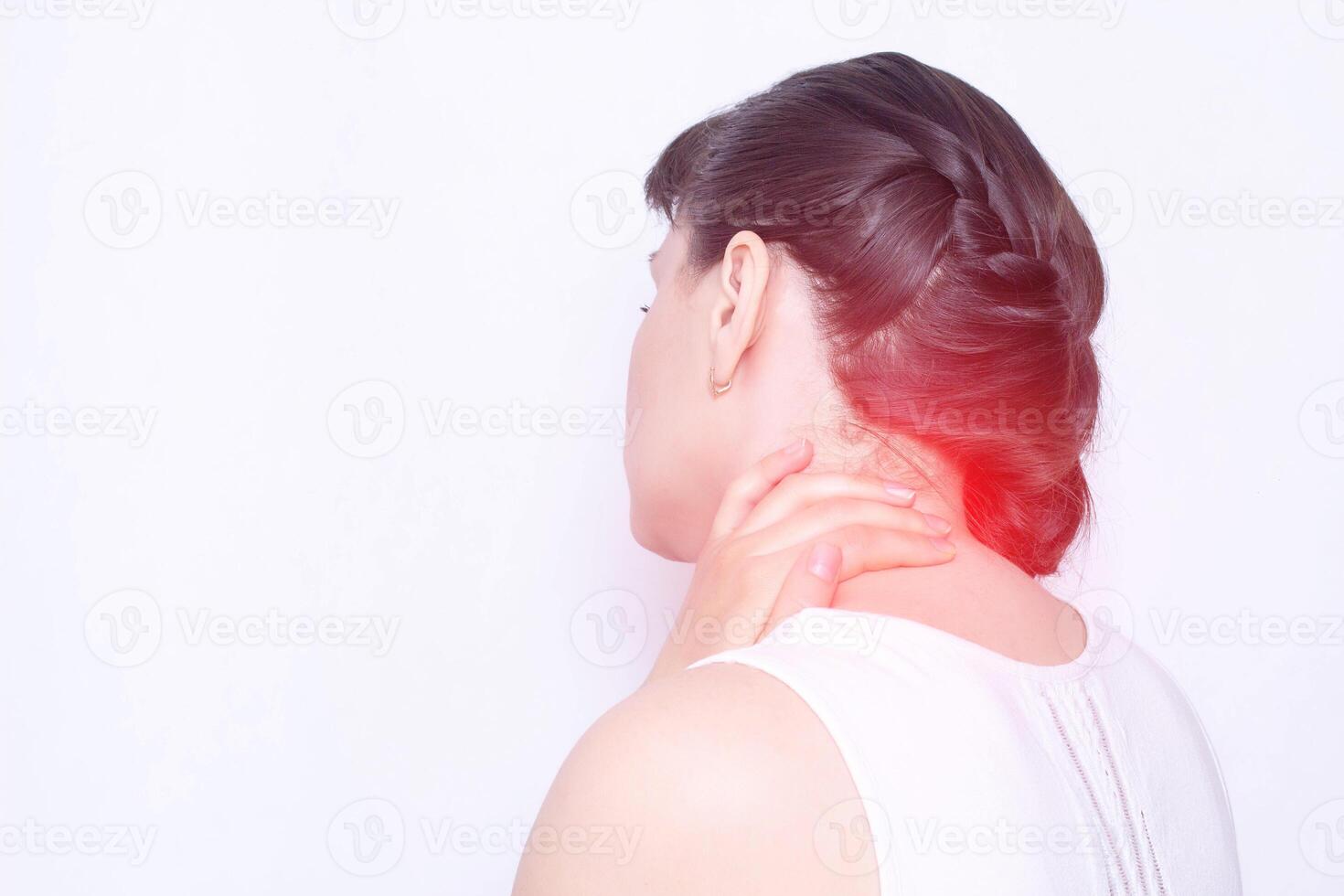 A young girl holds on to a sore neck in which the protrusion and fibromyalgia of the muscles, medical, copy space, vertebral instability photo