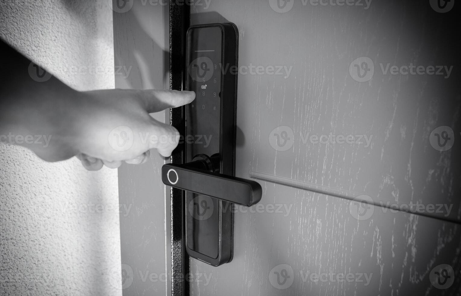 A thief is trying to break into an electronic door lock. A modern lock for entering with a client card or password, close-up photo