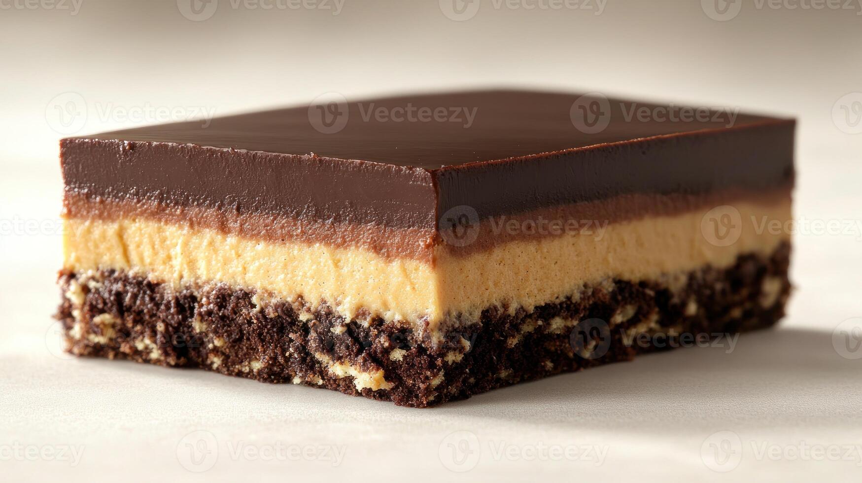 Indulging in the rich layers of a luscious chocolate and peanut butter dessert photo