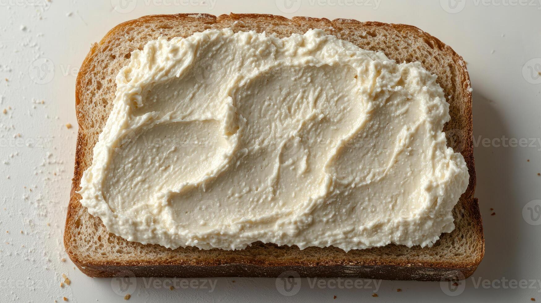 Butter cream spread artfully layered on fresh bread at home kitchen setting photo