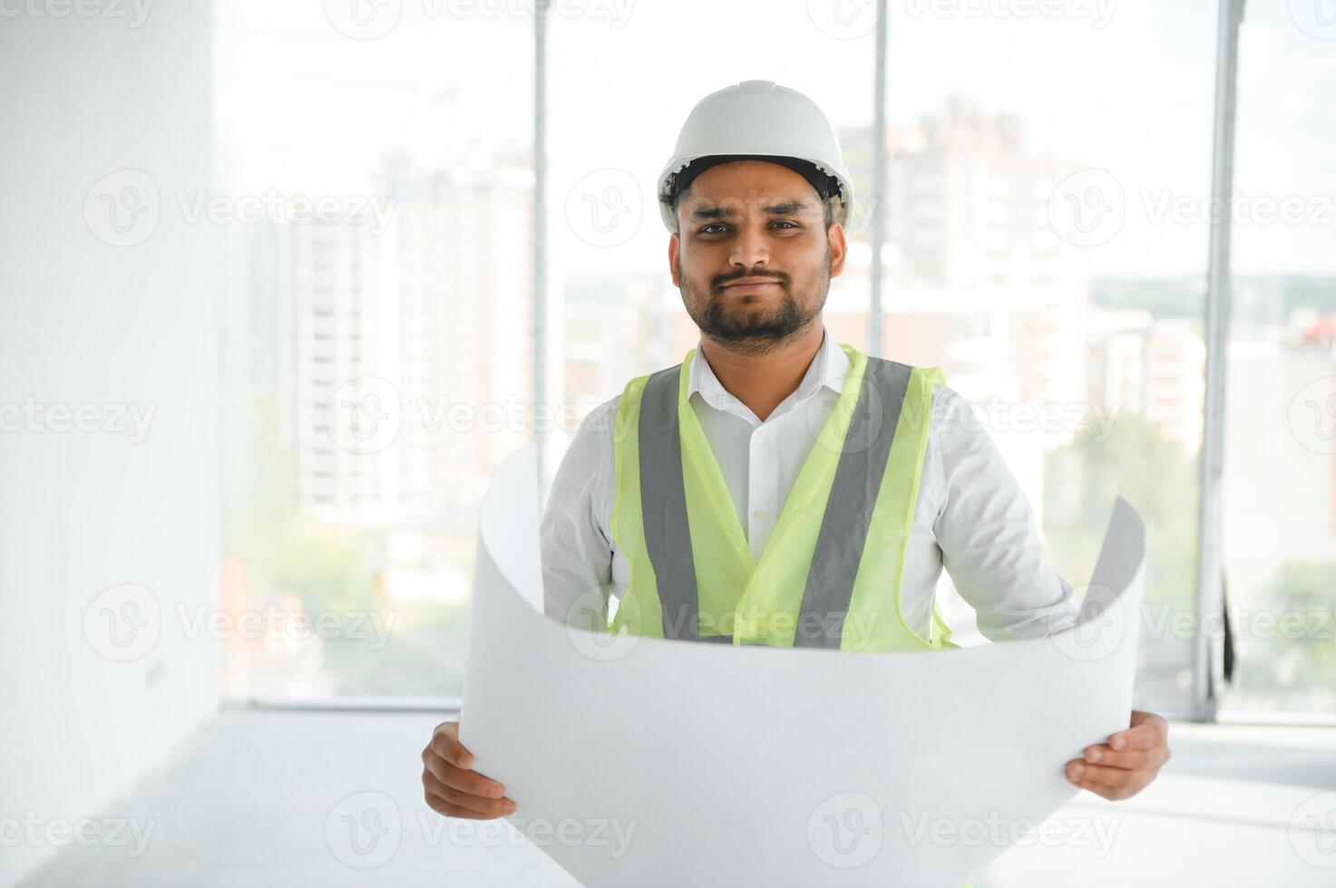 Portrait of a Indian engineer posing at the camera photo