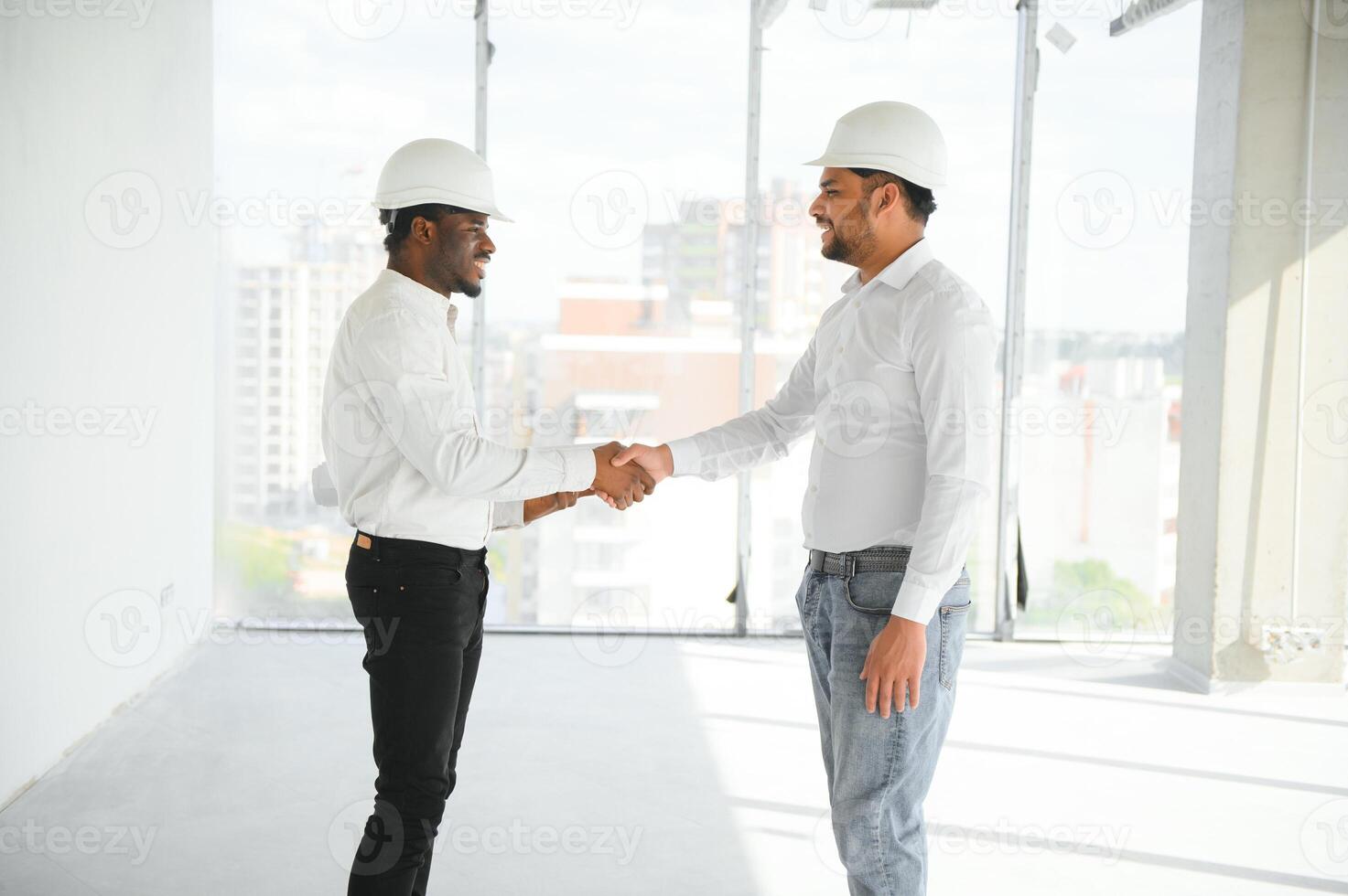 Group of multi ethnic engineer construction site worker meeting at workplace photo