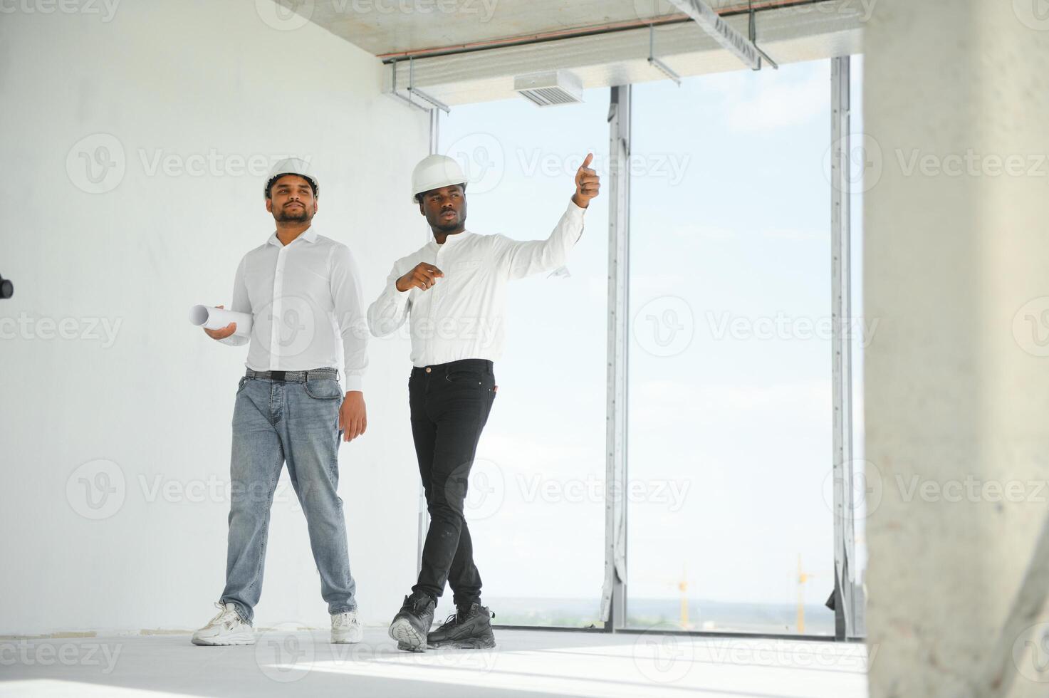 Group of multi ethnic engineer construction site worker meeting at workplace photo