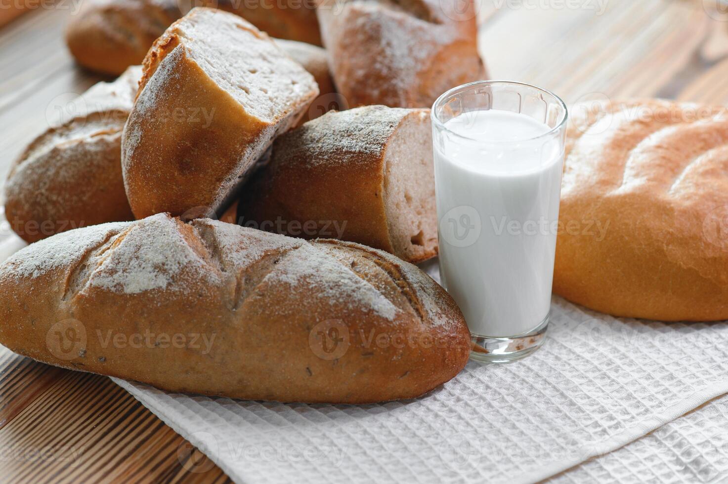 Freshly baked sourdough bread with a golden crust on bakery shelves. Baker shop context with delicious bread photo