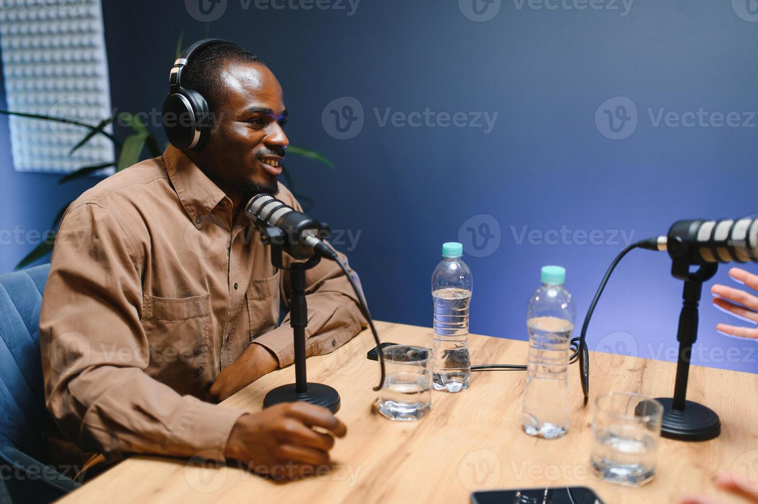 Handsome African American podcast host. Record a podcast or blog photo