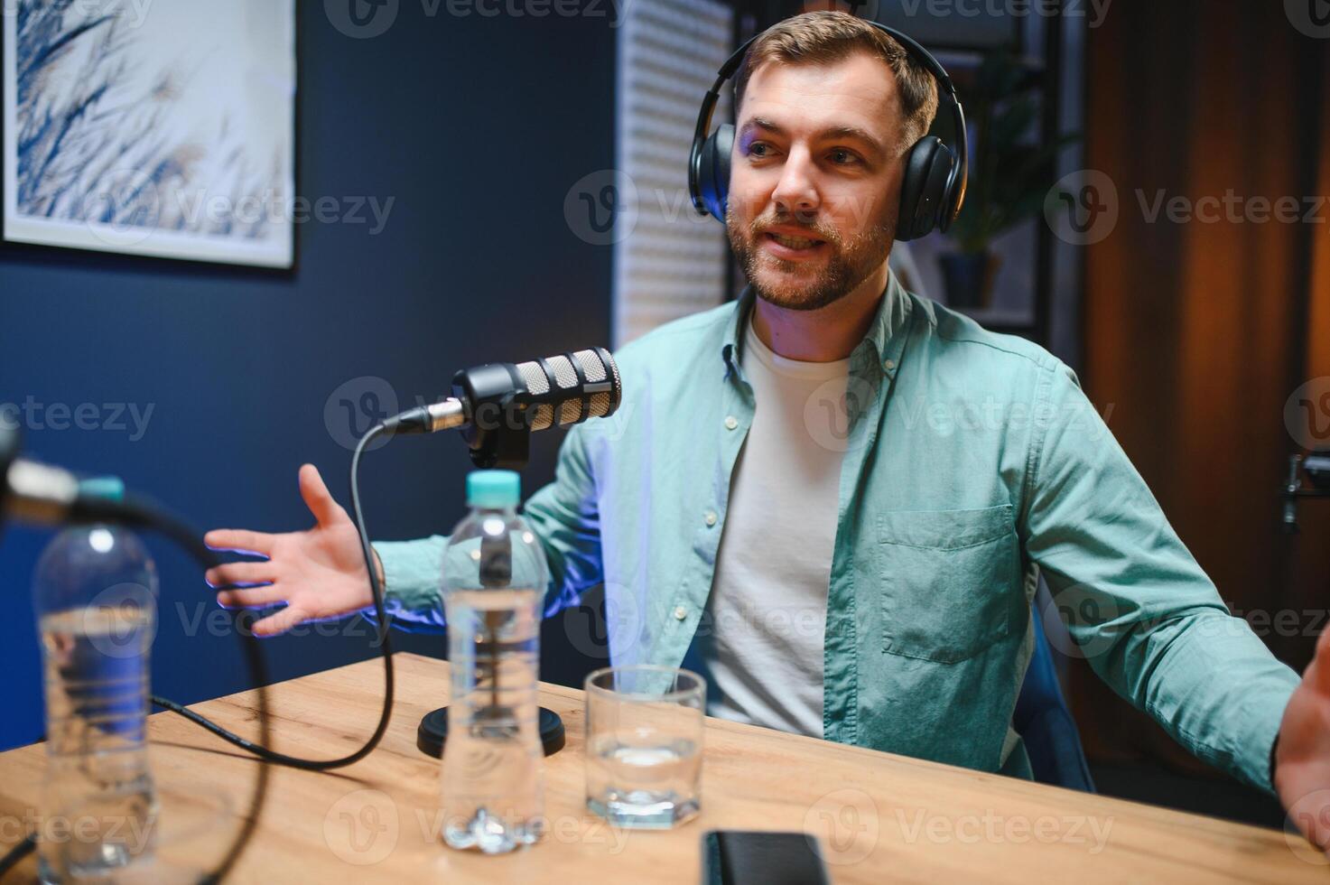 Podcast presenter having live discussion with man, streaming it for audience on internet entertainment show. Influencer enjoying chat with guest photo
