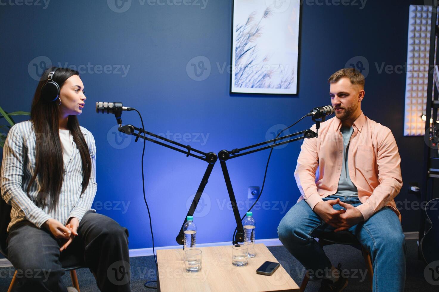 Show host interviewing woman during live stream, talking about fashion and style trends, disagreeing with her opinions. Man arguing with social media celebrity, recording podcast photo