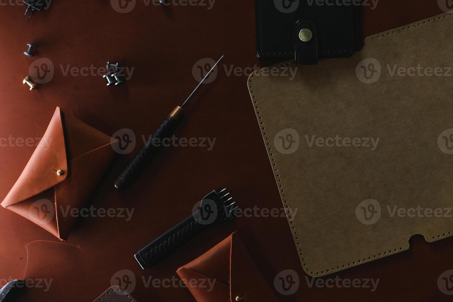 Crafting tools on natural cow leather in the tailoring workshop. Top view photo