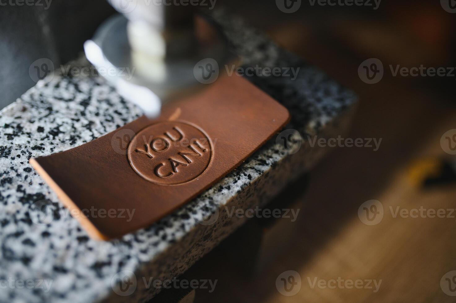 leather craftsman is carefully to make a leather product for a customer. Leather craftsman concept photo