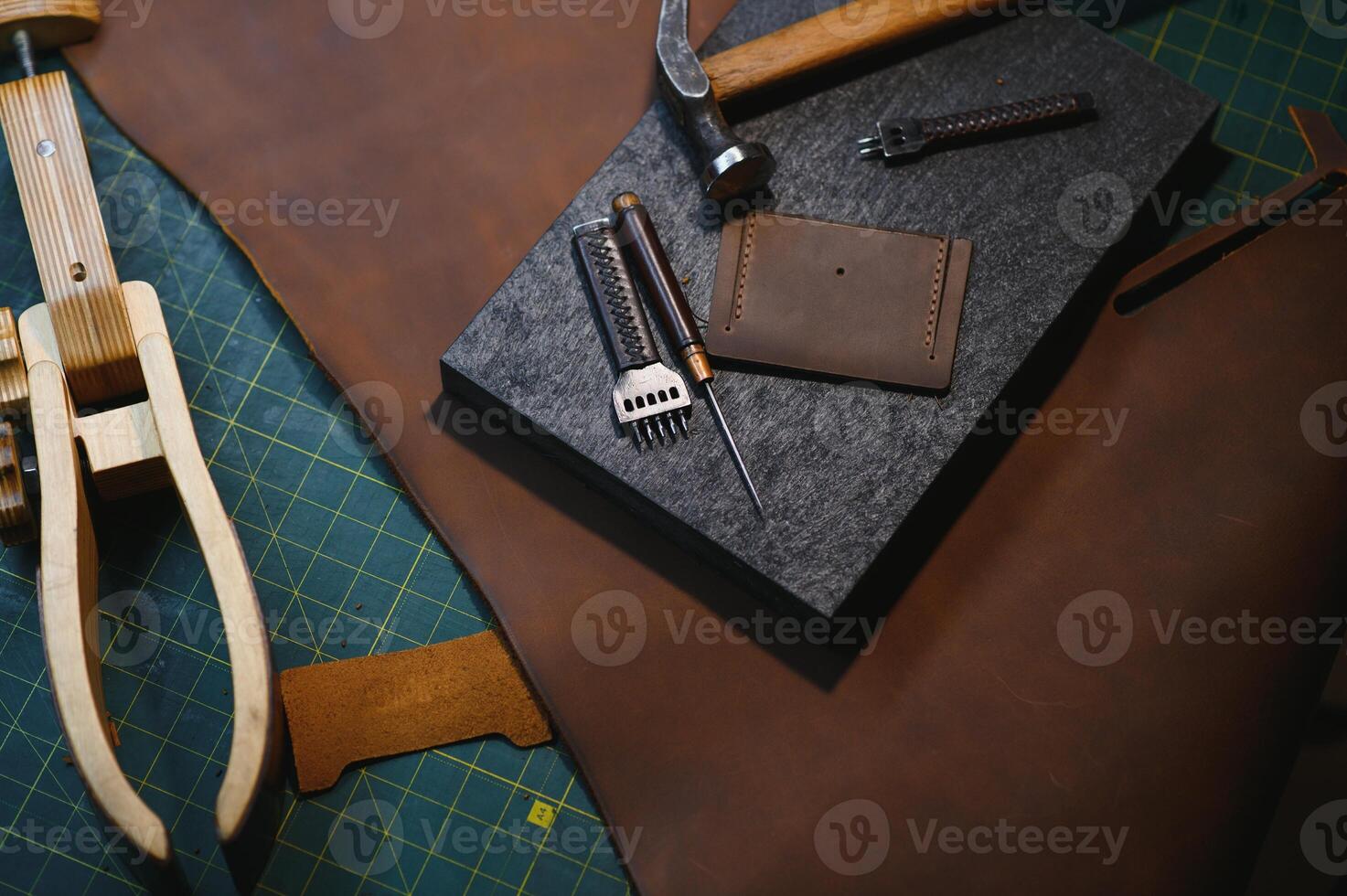 Crafting tools on natural cow leather in the tailoring workshop. Top view photo