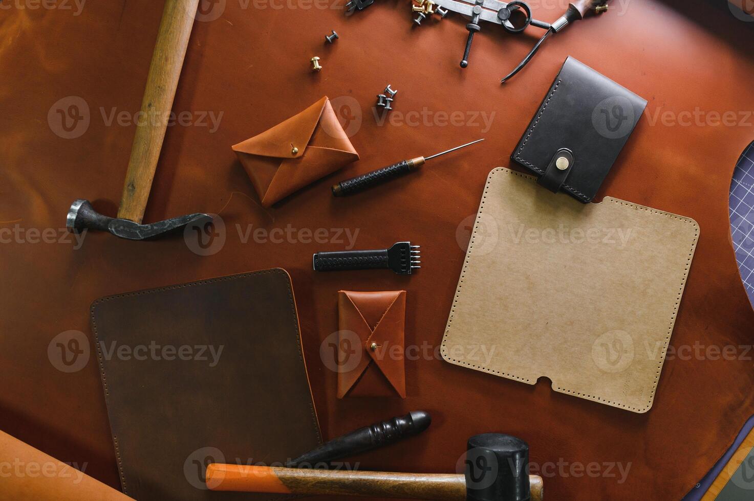 Crafting tools on natural cow leather in the tailoring workshop. Top view photo