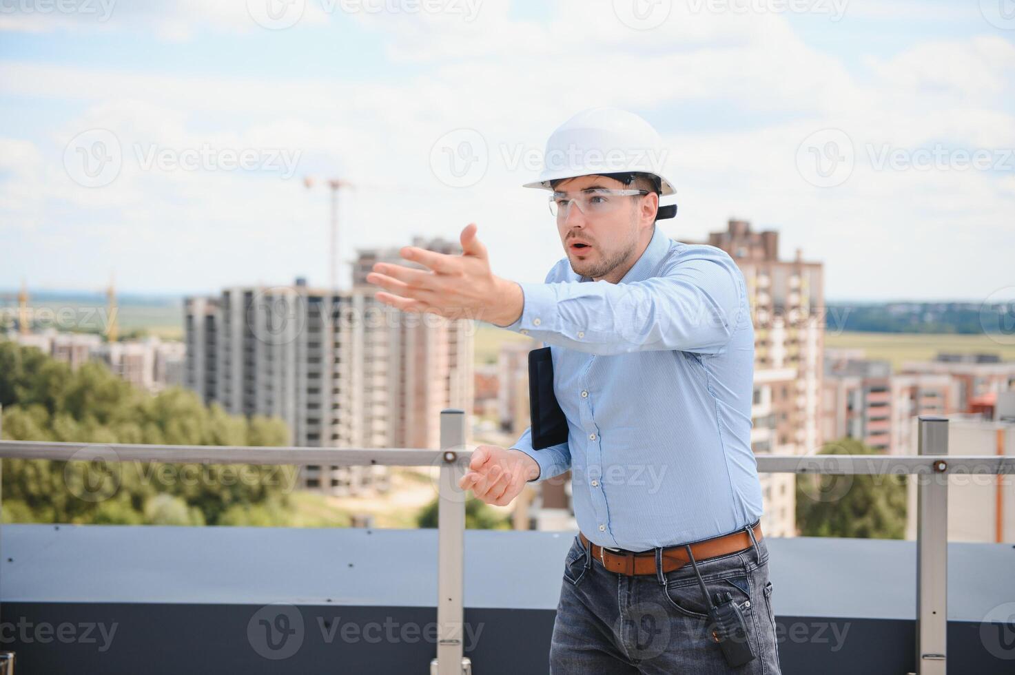 Engineer with tablet, building inspection. Construction man in helmet build new house photo