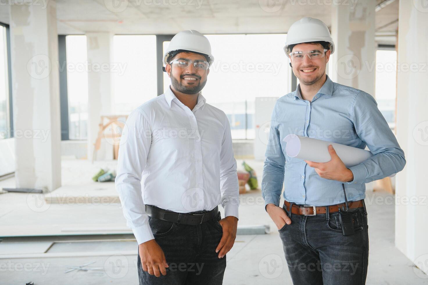 two architect engineers talking in a constructed office building photo
