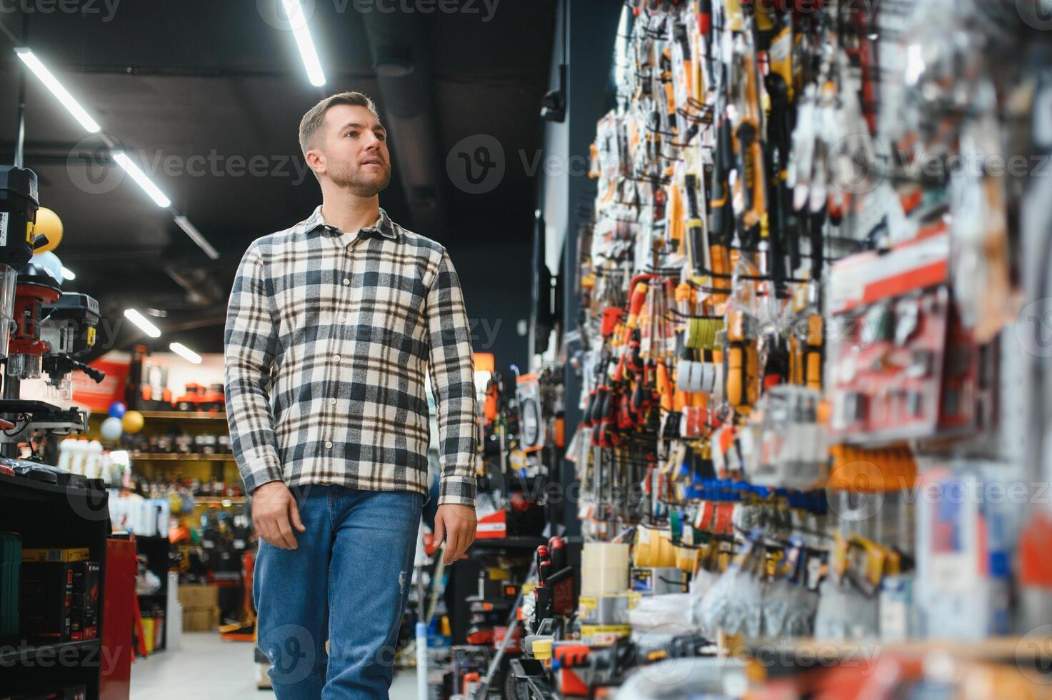 Portrait of mature man standing in hardware store photo
