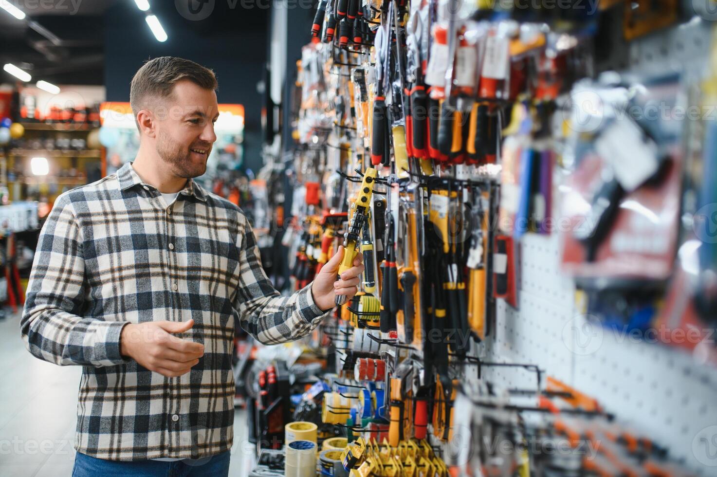 Portrait of mature man standing in hardware store photo