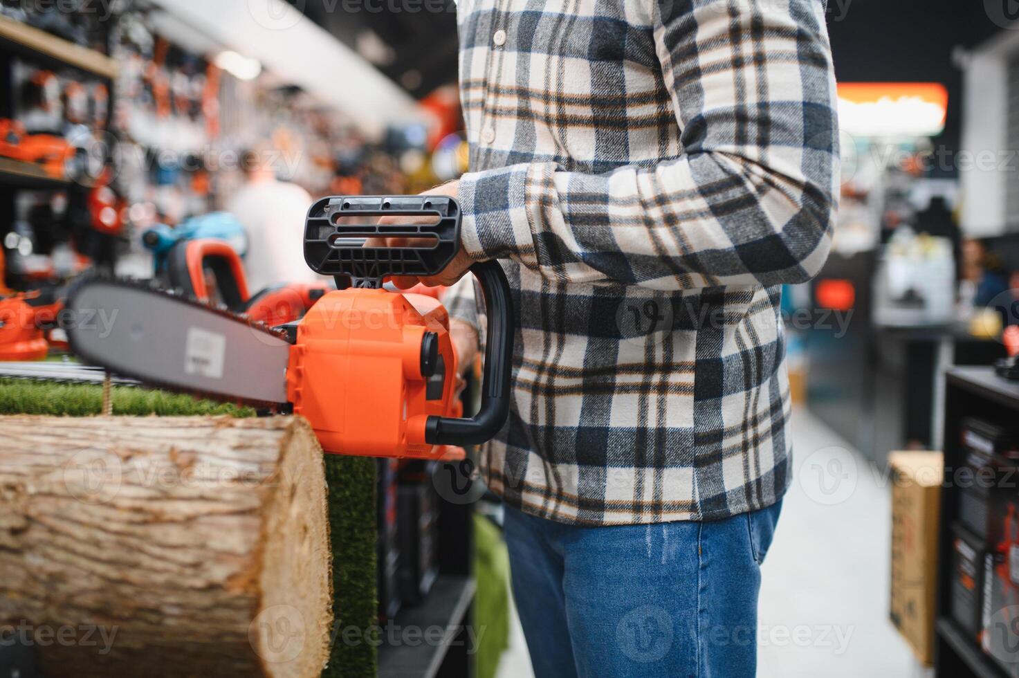 Man holds electric saw in tool store photo