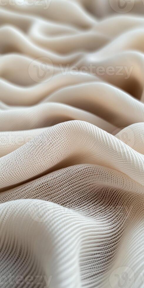 Soft beige fabric displaying elegant wavy texture photo
