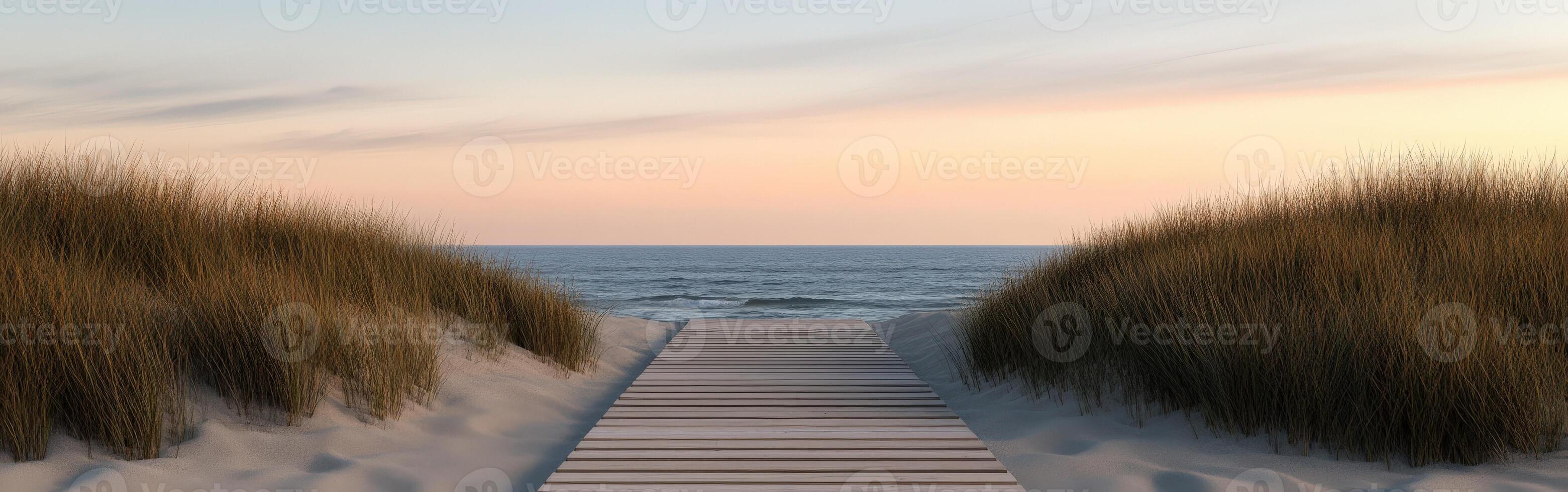 Tranquil pathway to the serene ocean at sunset photo