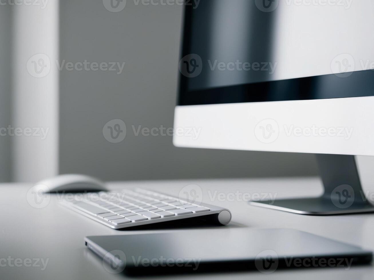 A computer workstation with a keyboard and a monitor. photo