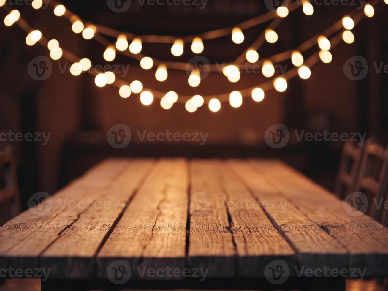 Rustic Wooden Table with String Lights Background. photo