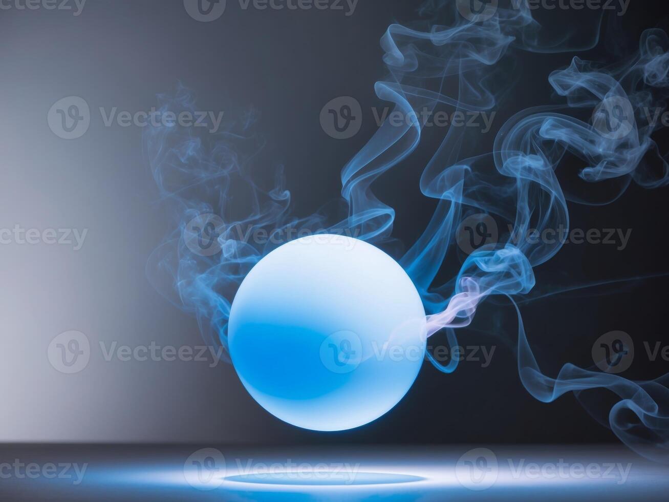 A glowing blue sphere with smoke coming out of it. photo