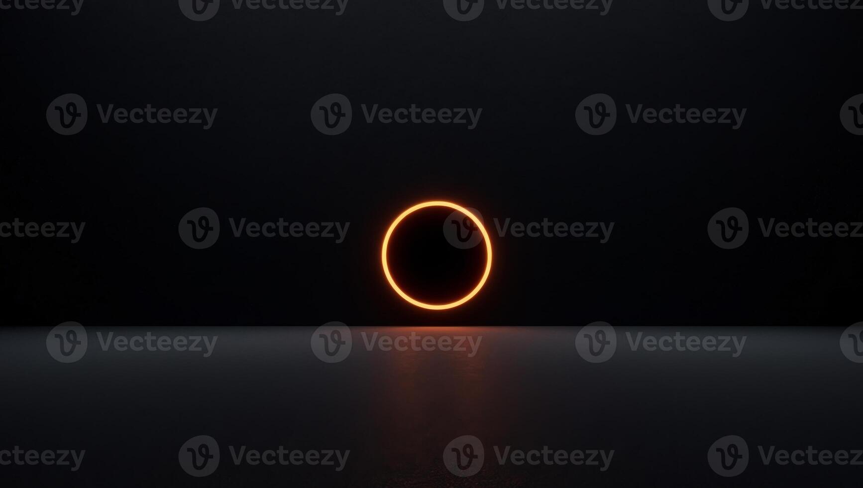 A black background with a glowing orange circle in the center. photo