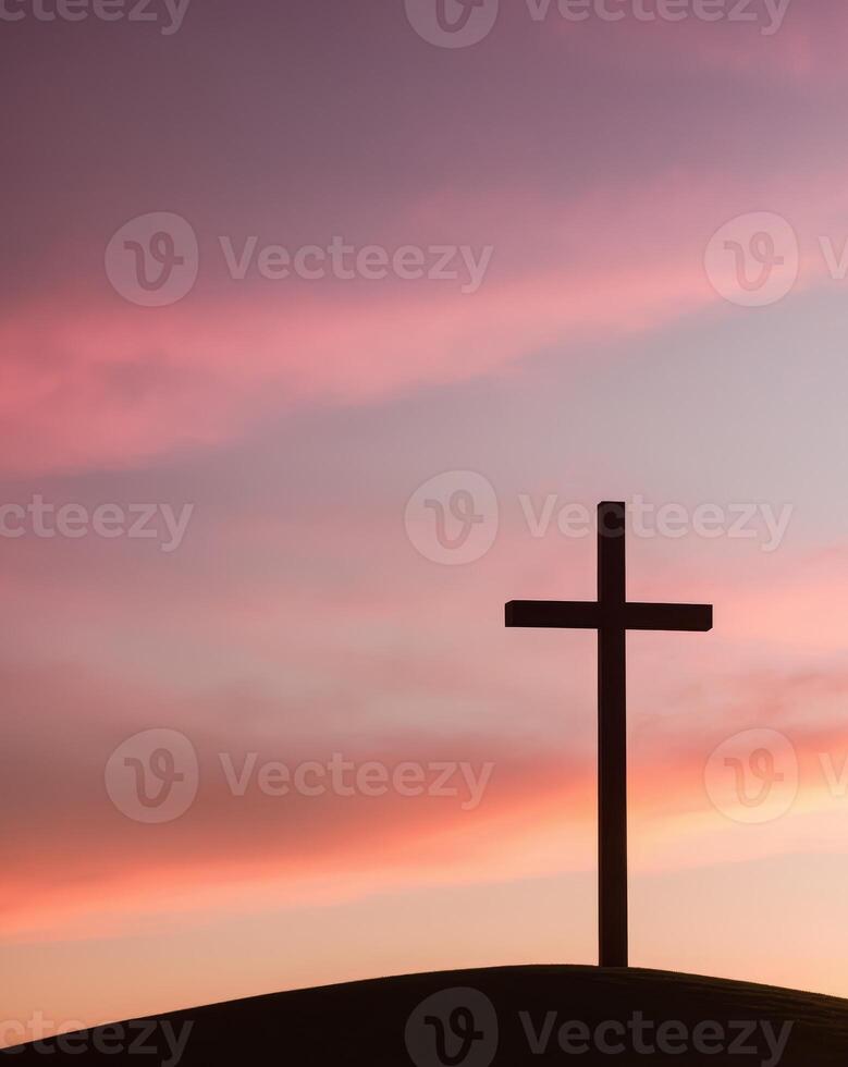 Silhouette of tall wooden Christian cross on small hill during sunset photo