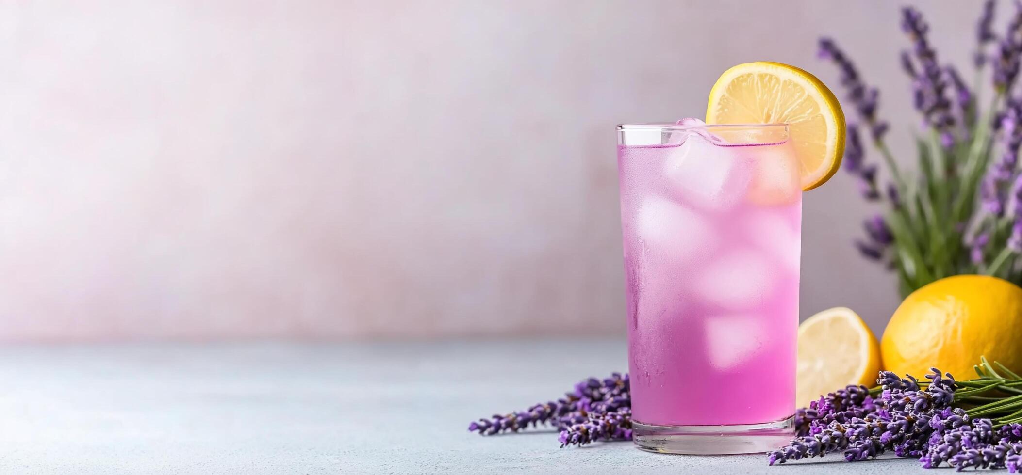 A refreshing lavender lemonade drink with lemon slices and lavender sprigs. photo