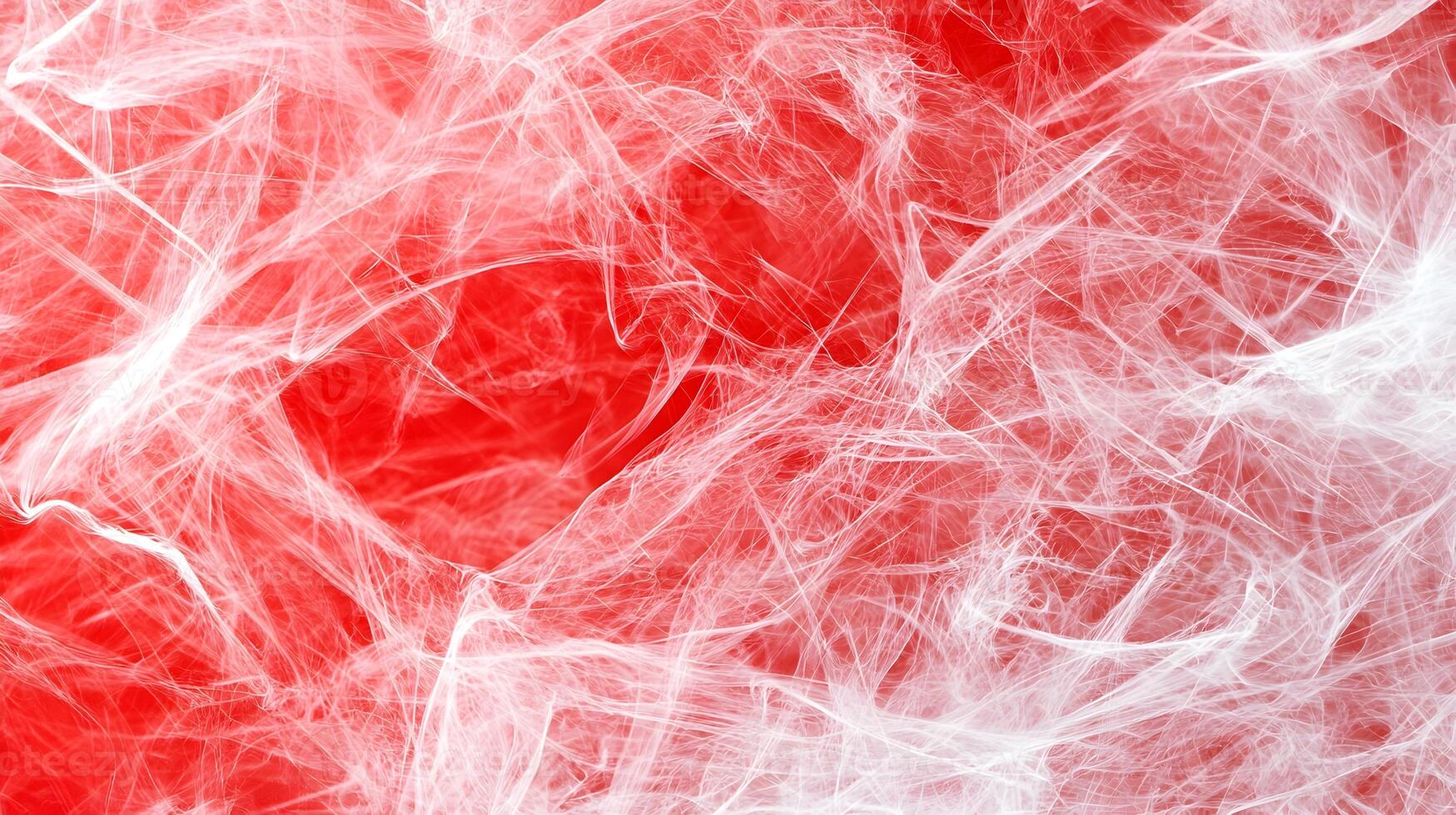 A red and white background with a spider web pattern photo