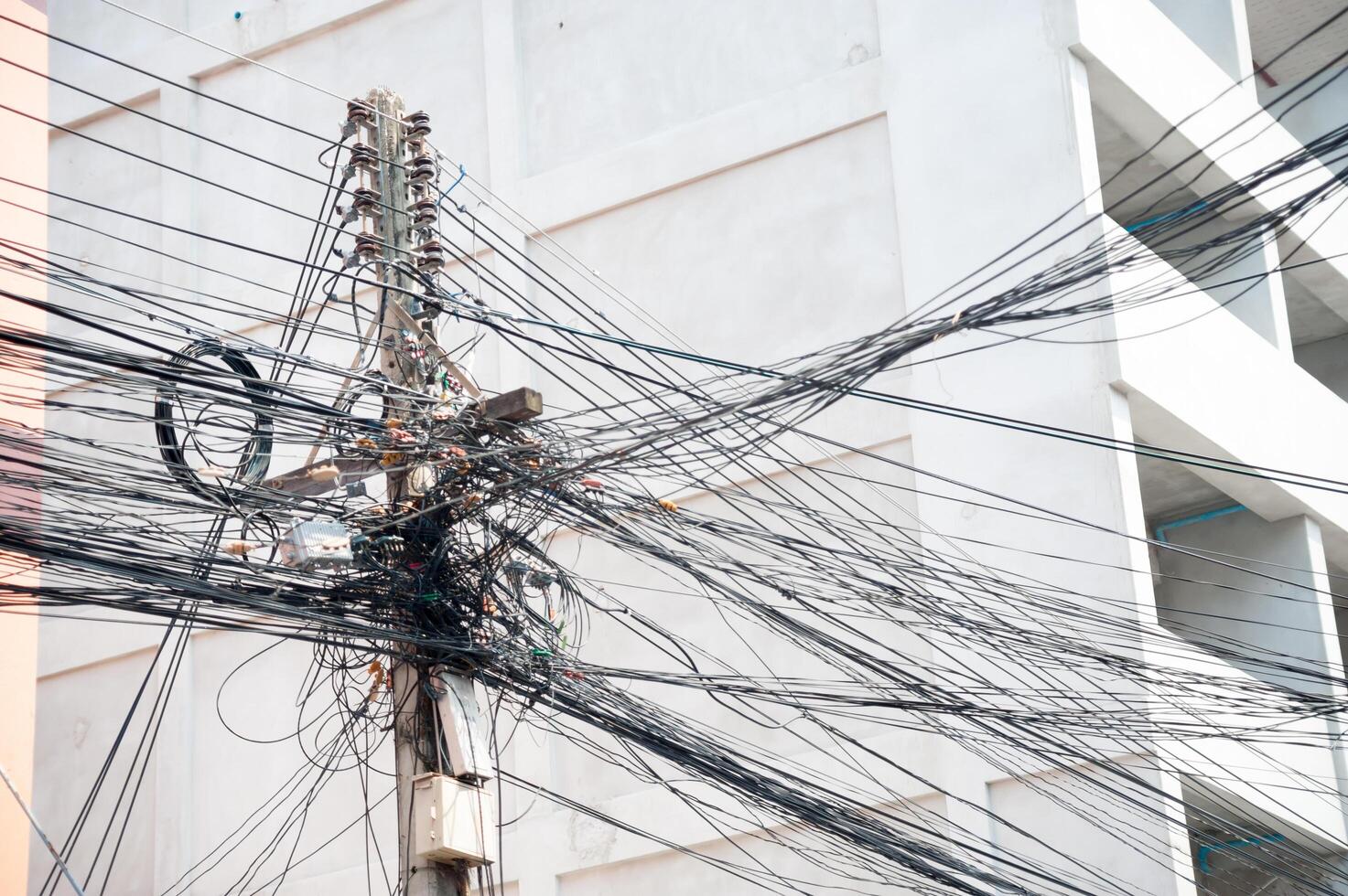 Pillar electric line in sun light photo