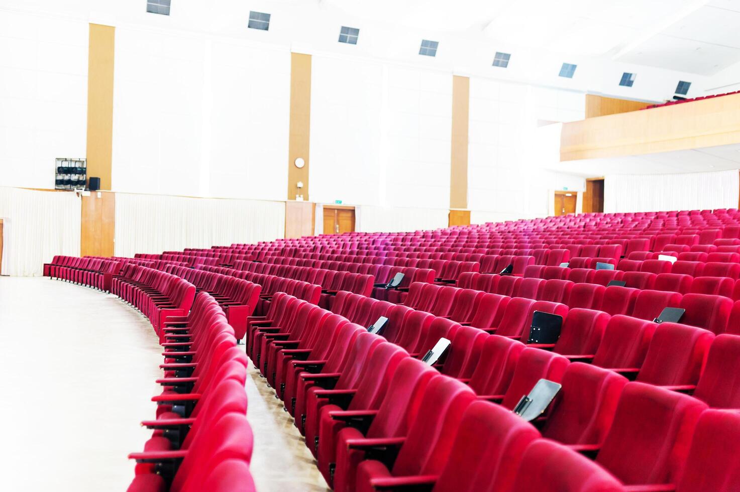 Empty seat on row in thearter closeup photo