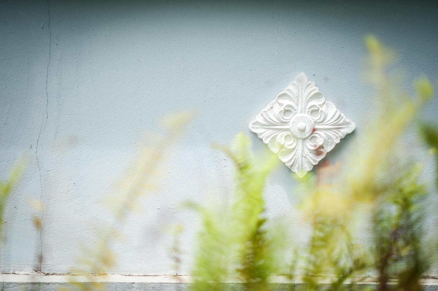 Carved flower line thai with soft light photo