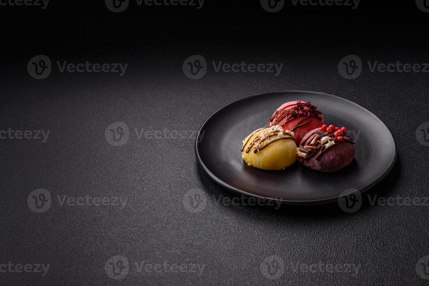 Delicious colorful asian mochi sweets with rice dough shell and fruit filling photo