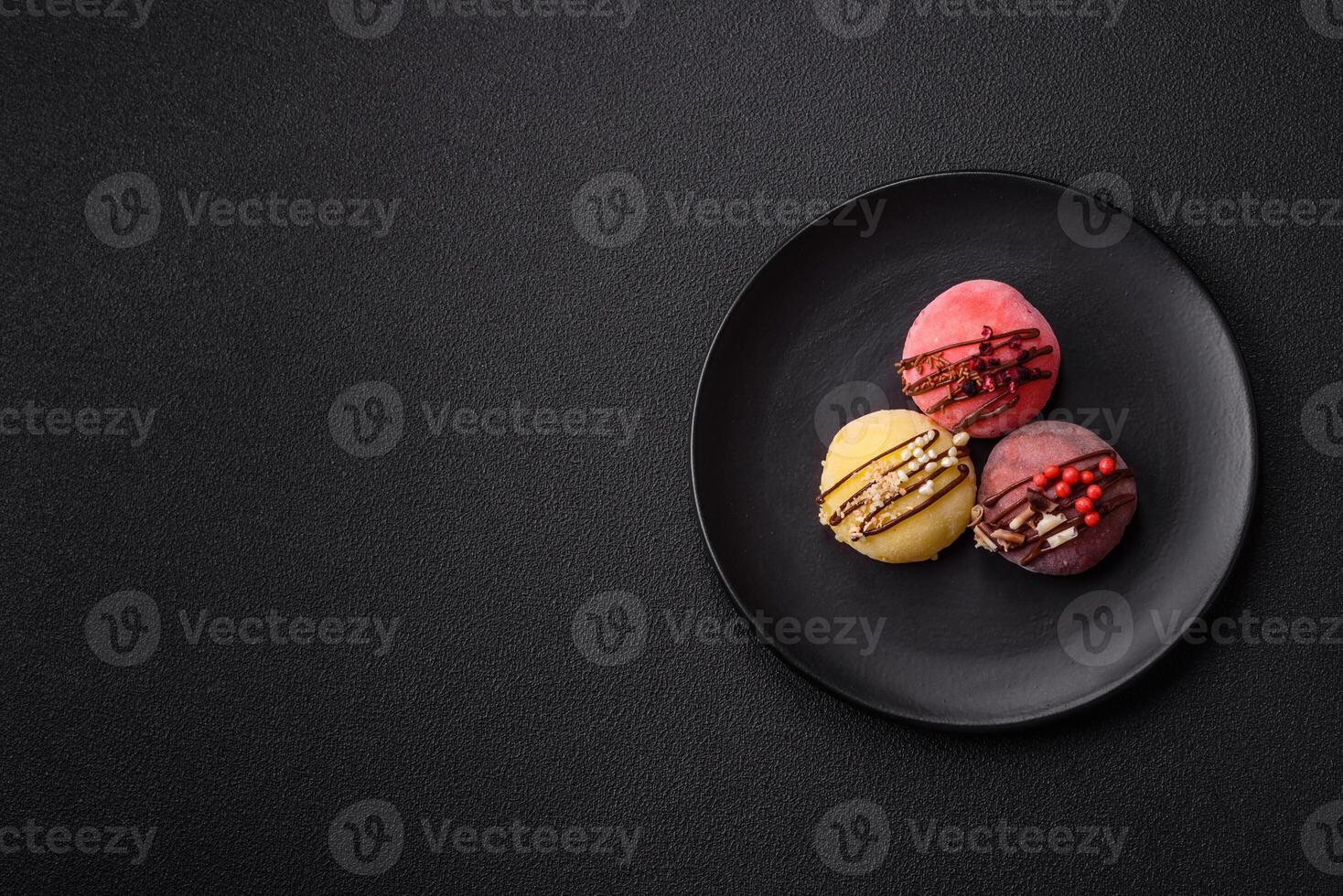 Delicious colorful asian mochi sweets with rice dough shell and fruit filling photo