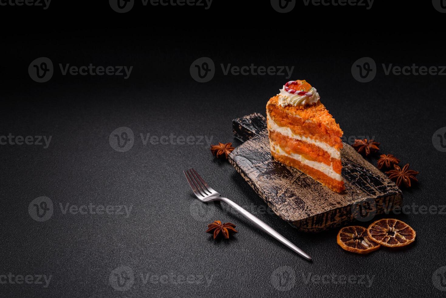 Piece of sweet layer cake with pumpkin or citrus flavor with cream photo