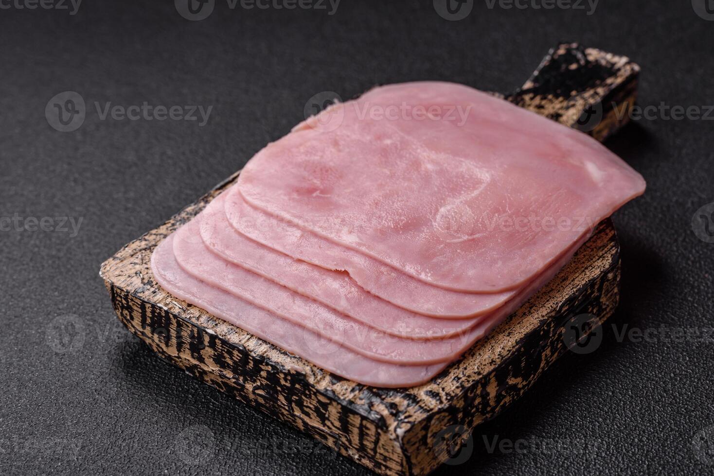 Boiled ham cut into square slices with sorrel and spices photo