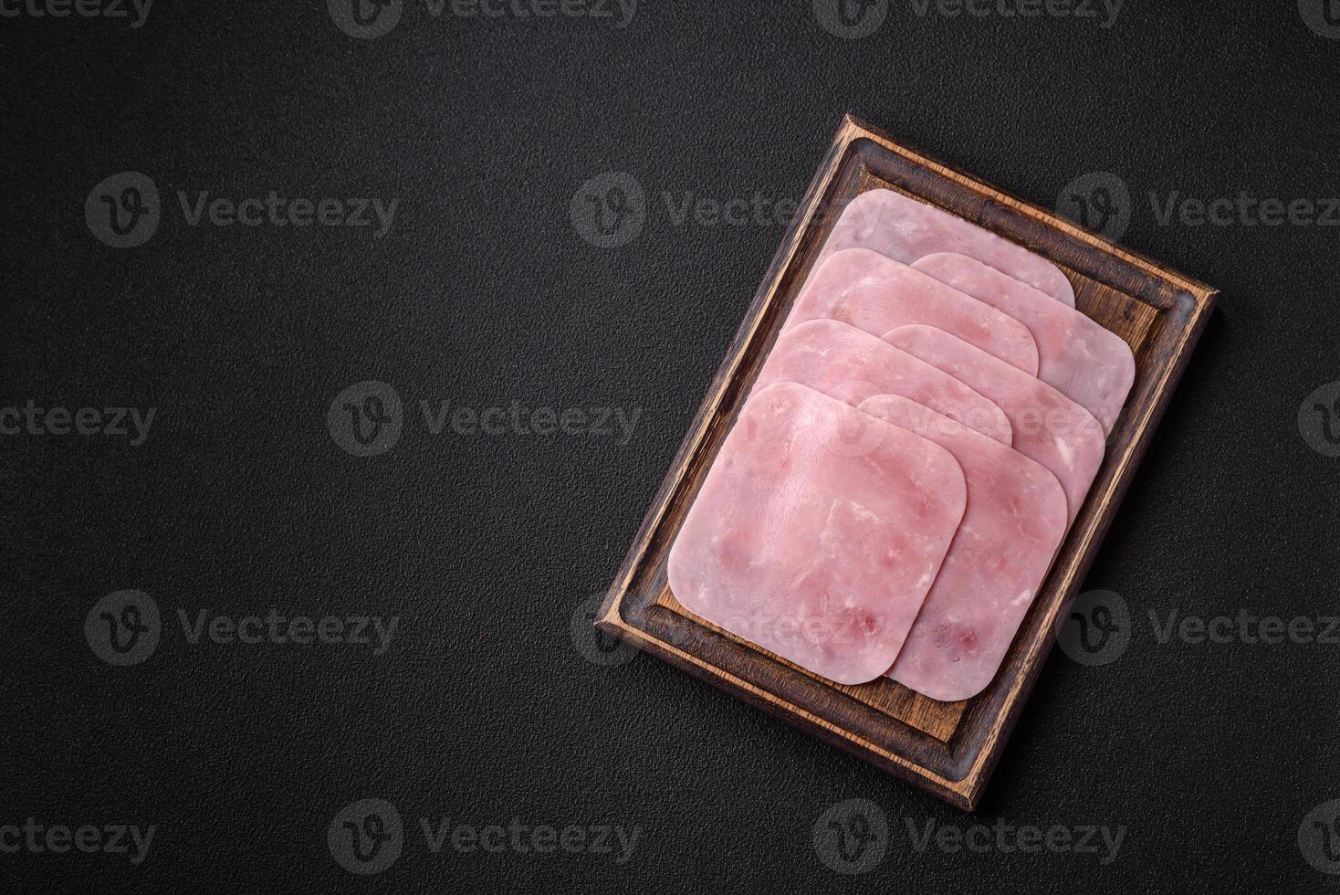 Boiled ham cut into square slices with sorrel and spices photo