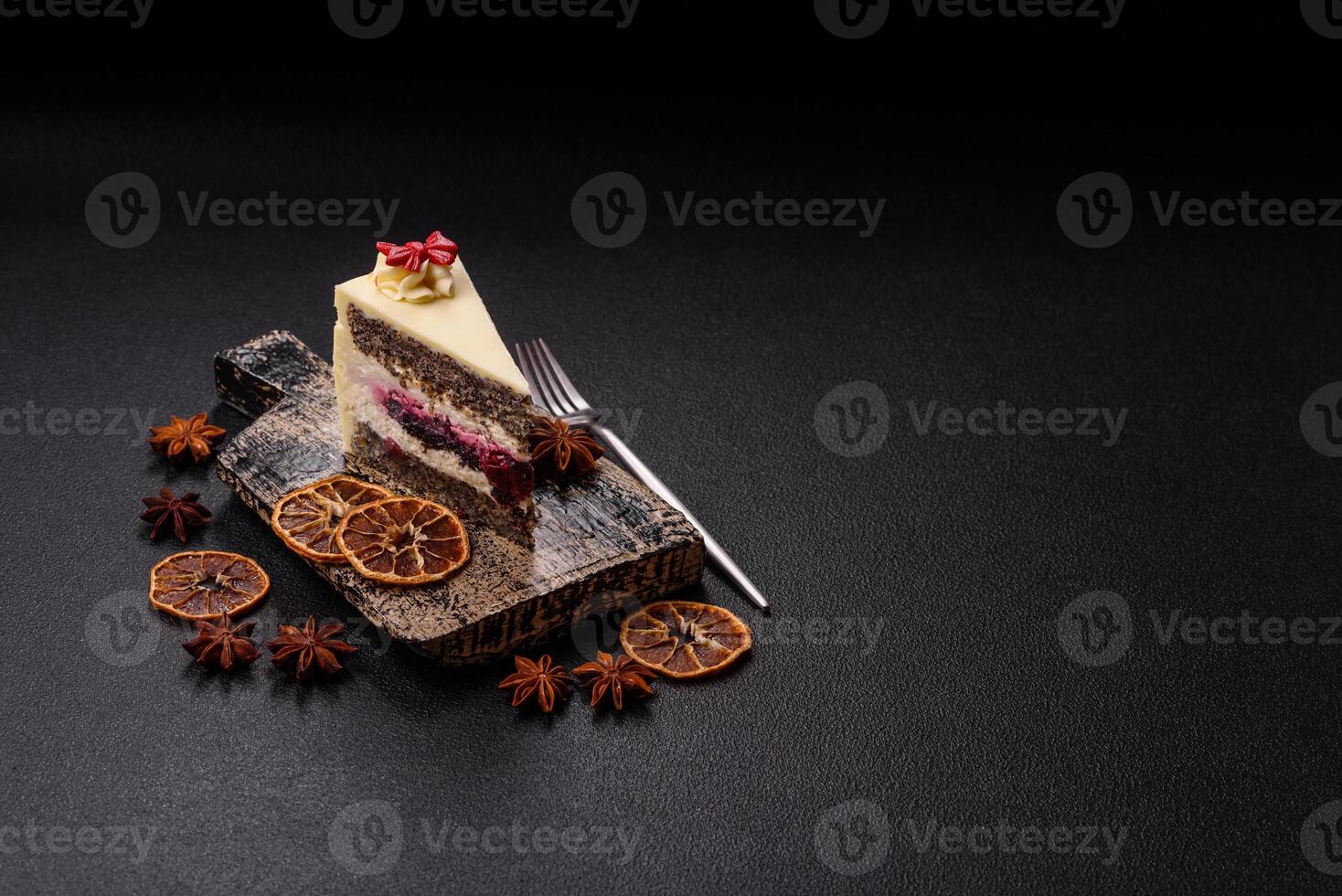 Piece of sweet layered cheesecake with cherries and poppy seeds photo