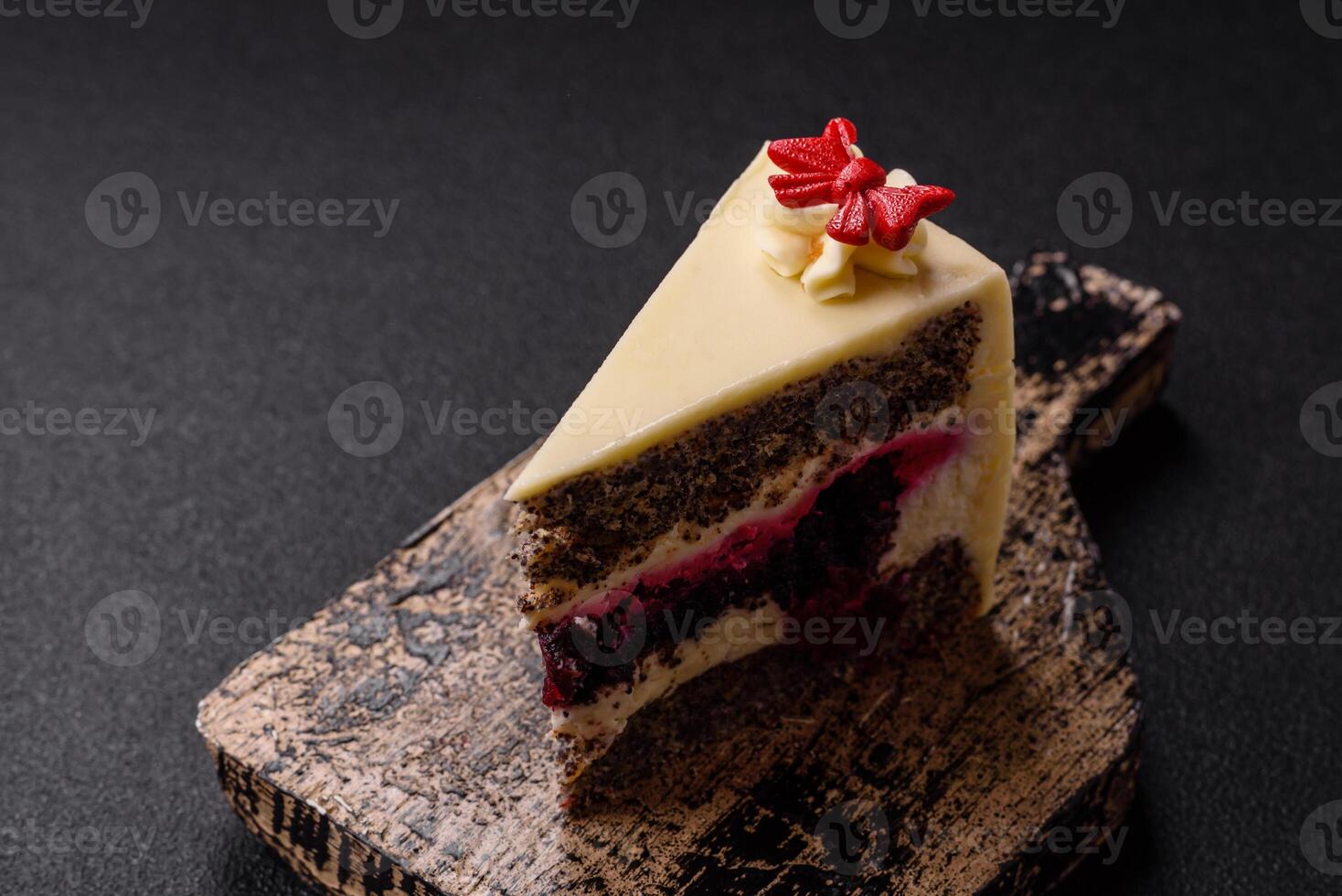 Piece of sweet layered cheesecake with cherries and poppy seeds photo