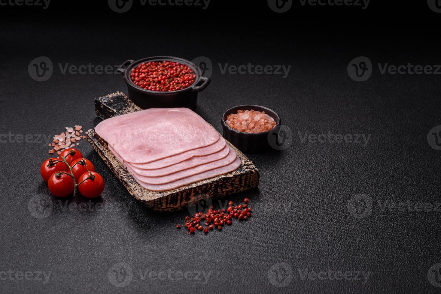 Boiled ham cut into square slices with sorrel and spices photo