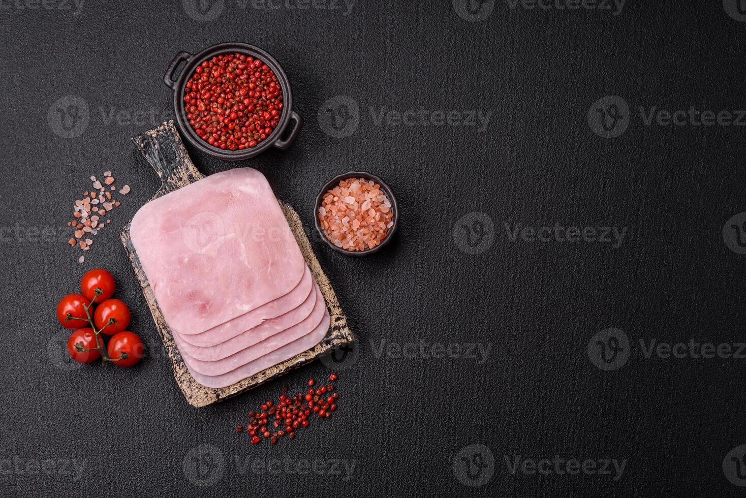 Boiled ham cut into square slices with sorrel and spices photo