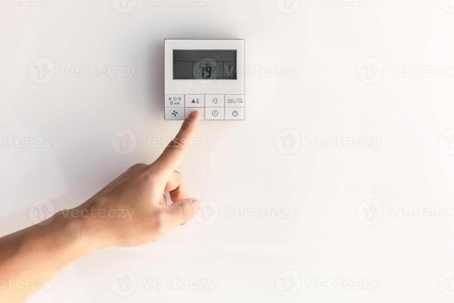 The air conditioning and heating control panel for the apartment and office is located on a white wall. photo